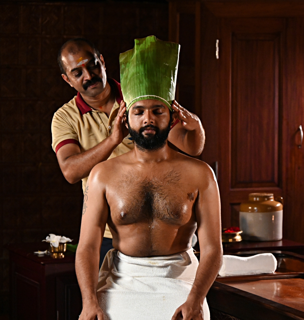 Traditional Ayurvedic Shirovasti head therapy being performed at an authentic Ayurveda centre in India
