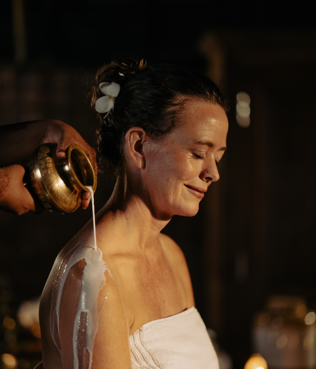 Traditional Ayurvedic therapy with warm herbal milk for deep relaxation and pitta balance